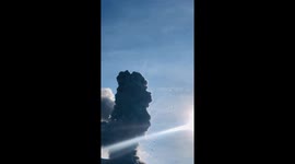 Tourists flee as volcano erupts in Indonesia