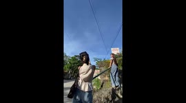 Lad topples off handrail while posing for pictures with friends