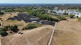 Drone footage shows burnt grassland as wildfire spreads on Woolwich Common