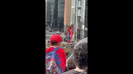 Young boy watches Tom Holland swing through Glasgow streets during Spider-Man filming