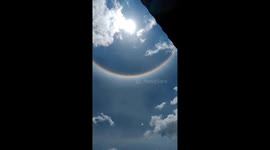 Stunning sun halo towers above homes in Indonesia