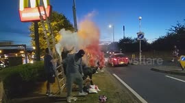 Harlow, United Kingdom – 08/25/2025 – A group of residents gathered along Southern Way in Harlow, Essex, at 8:00 PM to participate in