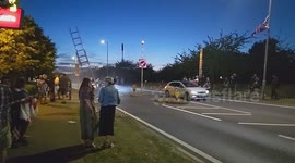 Harlow, United Kingdom – 08/25/2025 – A group of residents gathered along Southern Way in Harlow, Essex, at 8:00 PM to participate in