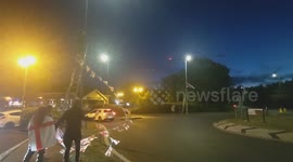 Harlow, United Kingdom – 08/25/2025 – A group of residents gathered along Southern Way in Harlow, Essex, at 8:00 PM to participate in