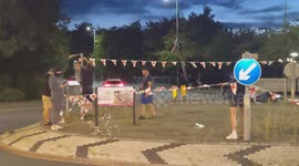 Harlow, United Kingdom – 08/25/2025 – A group of residents gathered along Southern Way in Harlow, Essex, at 8:00 PM to participate in