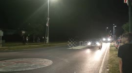 Harlow, United Kingdom – 08/25/2025 – A group of residents gathered along Southern Way in Harlow, Essex, at 8:00 PM to participate in