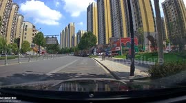 Car swallowed up by sinkhole on road in China