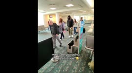 'You shall not pass!' Little boy sticks out foot to block passing traveller's suitcase