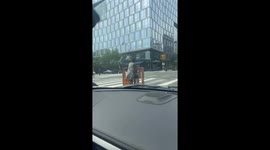 Woman Carries Bookshelf on a Scooter
