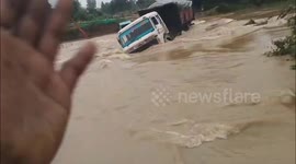 Horrifying Visuals: Trailer Swept Away in Odisha Floodwaters, Driver Missing