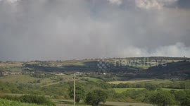 Short timelapse of smoke from wildfire behind woodsmith mine