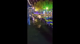 Man nearly falls while crossing floating obstacle course in Liaoning, China
