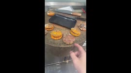 Man playfully tests scallop reaction in Guizhou, China