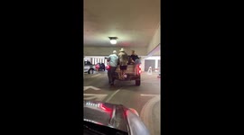 Crowd Helps Weigh Down Too-Tall Truck