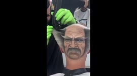 Barber Creates Face on Back Head