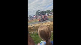 Brave stunt driver exits moving car to wave at crowds before re-entering spinning vehicle