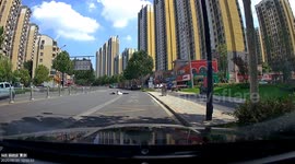 Car swallowed up by sinkhole on road in China
