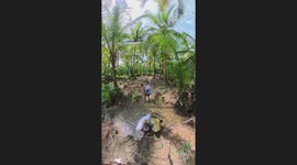 Boyfriend slips while carrying partner across river