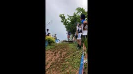 Downhill mountain bike rider crashes head-over-handlebars on trail
