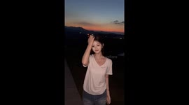 Girl's posing video goes wrong when bug lands on her chest
