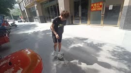 Youngster showing off football skills crashes into road barrier