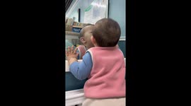 Baby Sees Himself in the Mirror