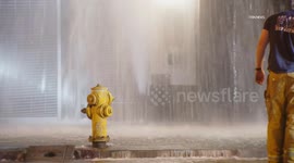 US, Los Angeles: Downtown Los Angeles Water Main Break Floods Sidewalk, Street