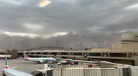 Imposing dust storm sweeps through airport in Phoenix