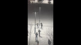 Dancing Couples Amidst Snowfall