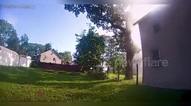 Officers catch child jumping from window during house fire