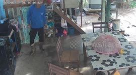 Boy pulls spiky durian from table only for it to land on his face
