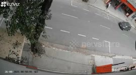 Drill rig falls onto crowded street narrowly missing cars and pedestrians