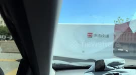 Self-driving robot truck drives across road construction