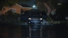 US, Los Angeles: Florence Water Floods Street Following Crash Into Hydrant