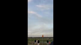 This video captures the tragic crash of a Polish Air Force F-16 fighter jet from the Tiger Demo Team. The footage shows the aircraft performing a low-altitude maneuver before it impacts the ground and erupts into a massive fireball. The incident occurred