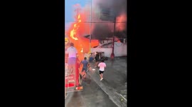 Fire crews battle blaze at home in the Philippines