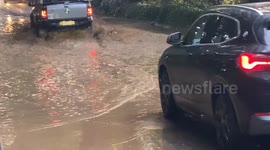 Traffic hold ups: Torrential overnight rain has flooded the A30 at Newlyn in Cornwall creating travel issues for motorists
