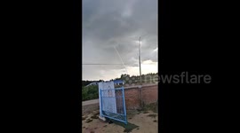 Spectacular waterspout appears over Chinese lake like 'straw to the sky'