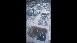 Bystanders rush to rescue of biker who fell into open drain in India