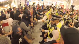 Police deploy pepper spray as this Anti migrant protesters clash with officers in Canary Wharf Shopping Centre