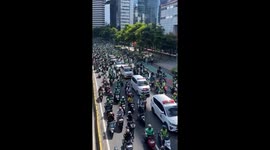 Delivery riders form convoy in support of slain colleague in Indonesia