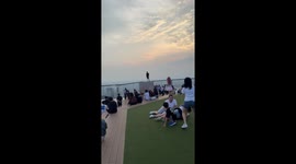 Tourist sparks panic standing on edge of skyscraper in Japan