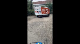 Self-driving robot delivery van struggles with bumpy dirt road in China