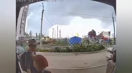 Bouncy castle with children lifted and thrown into air by wind