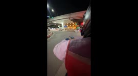 Pet squirrel joins motorcycle taxi rider at work by riding on his shoulder