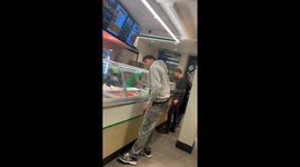 Boy tries to act cool by leaning on curved glass but fails miserably