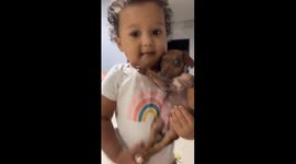 Baby Holding a Baby