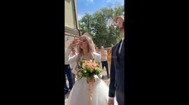 Bridge tosses champagne glass over shoulder straight into car's windshield