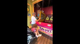 Little girl makes perfect shot at Disneyland Adventure Park in Anaheim, California