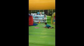 Kids playing on inflatable bouncy castle in Puerto Rico, Gran Canaria, Spain